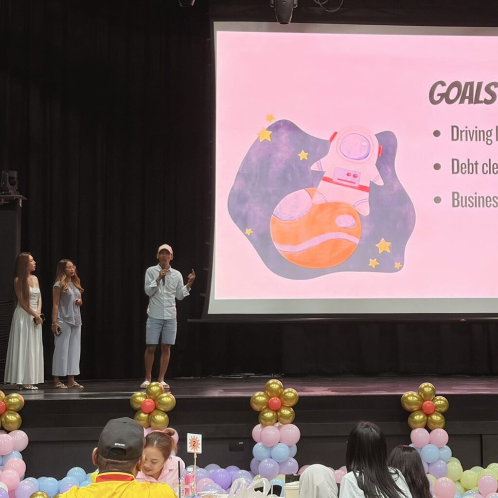A proud graduate shares their journey and achievements at the Empowering Families Initiative Graduation Day.