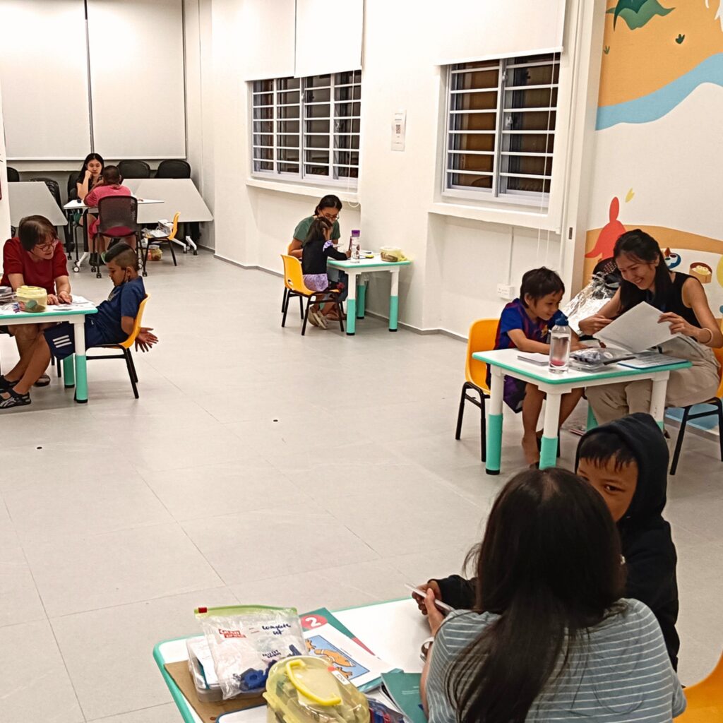Volunteers supporting children's learning and development through personalised guidance in the KKCS - BRIGHT Programme.